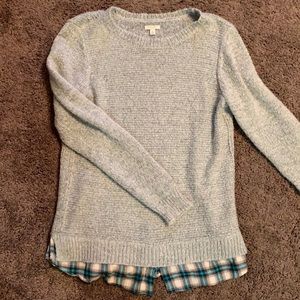 Gray sweater with plaid underlay